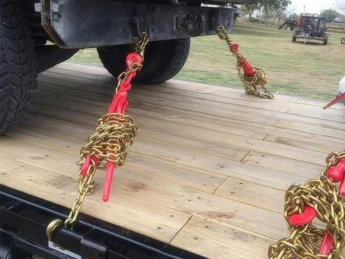 Close up of a lever action load binder mechanism